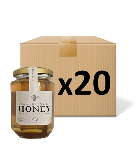 20 jars of pure raw Addlestone Honey with a bulk cardboard box, on a white background.