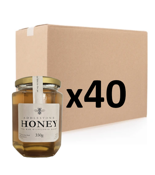 40 jars of pure raw Addlestone, Surrey Honey with a bulk cardboard box, on a white background.