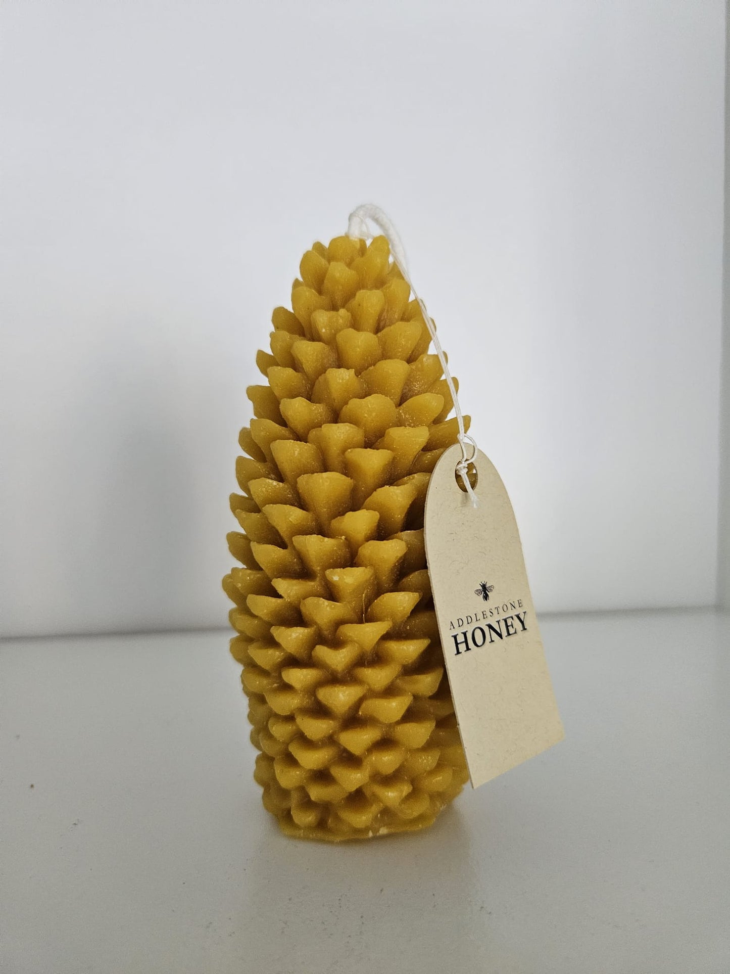 Handmade pure beeswax pinecone candle, 15hr burn time, 11.5 x 5.5cm - Addlestone honey