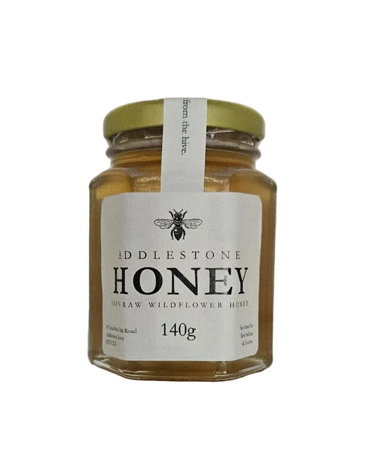 140 gram jar of pure raw wildflower honey