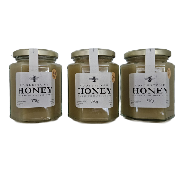 Jars of set raw wildflower honey