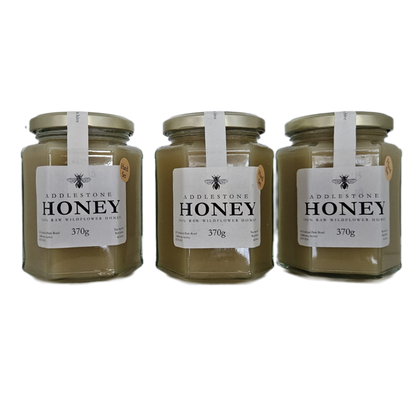 Jars of set raw wildflower honey