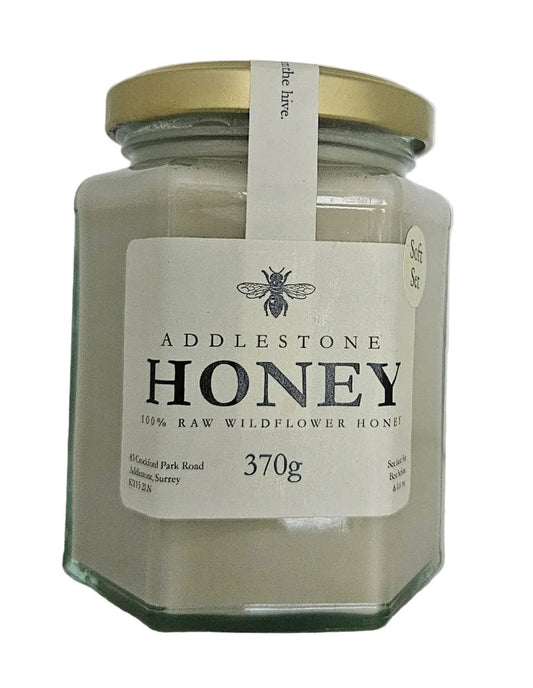 Jar of Addlestone soft set creamed Honey with a gold lid on a white background