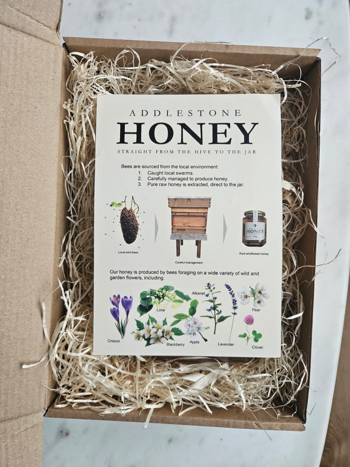 Addlestone Honey giftbox packaging with botanical illustrations.