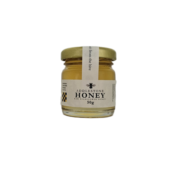 A single 50g mini jar of raw wildflower honey